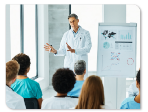 Male in lab coat giving a presentation